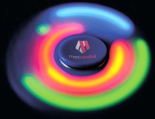 LED Fidget Spinner spinning in the dark showing your printed logo