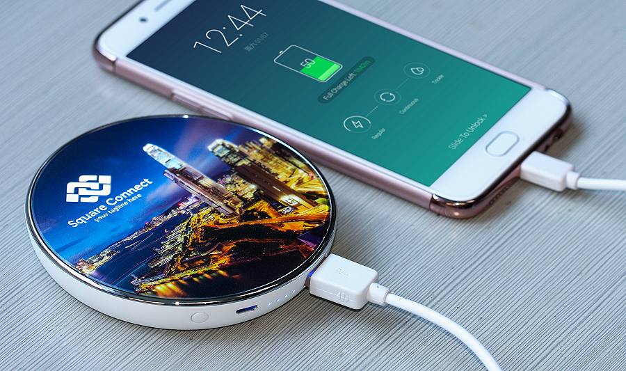 Promotional Wireless Power Bank QI Chargers charging a Samsung mobile